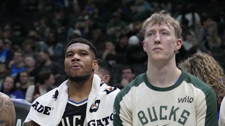 Mar 9, 2025; Milwaukee, Wisconsin, USA; Milwaukee Bucks forward Giannis Antetokounmpo (34) and Milwaukee Bucks guard AJ Green (20) look on during the fourth quarter against the Cleveland Cavaliers at Fiserv Forum. Mandatory Credit: Michael McLoone-Imagn Images