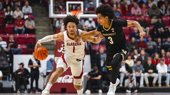 Jan 21, 2025; Tuscaloosa, Alabama, USA; Alabama Crimson Tide guard Mark Sears (1) drives the ball against Vanderbilt Commodores guard Tyler Tanner (3) during the second half at Coleman Coliseum. Mandatory Credit: Will McLelland-Imagn Images