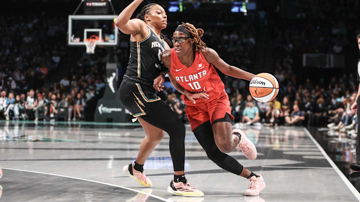 Sep 24, 2024; Brooklyn, New York, USA; Atlanta Dream guard Rhyne Howard (10) drives past New York Liberty forward Betnijah Laney-Hamilton (44) during game two of the first round of the 2024 WNBA Playoffs at Barclays Center. Mandatory Credit: Wendell Cruz-Imagn Images Sep 24, 2024; Brooklyn, New York, USA; Atlanta Dream guard Rhyne Howard (10) drives past New York Liberty forward Betnijah Laney-Hamilton (44) during game two of the first round of the 2024 WNBA Playoffs at Barclays Center. Mandatory Credit: Wendell Cruz-Imagn Images