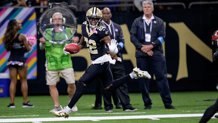 Oct 13, 2024; New Orleans, Louisiana, USA; New Orleans Saints wide receiver Rashid Shaheed (22) returns a punt for a touchdown during the second quarter against the Tampa Bay Buccaneers at Caesars Superdome. Mandatory Credit: Matthew Hinton-Imagn Images