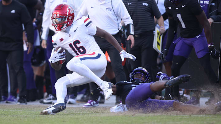 Nov 23, 2024; Fort Worth, Texas, USA; Arizona Wildcats wide receiver Chris Hunter (16) runs with the ball against the TCU Horned Frogs in the second half at Amon G. Carter Stadium. Mandatory Credit: Tim Heitman-Imagn Images