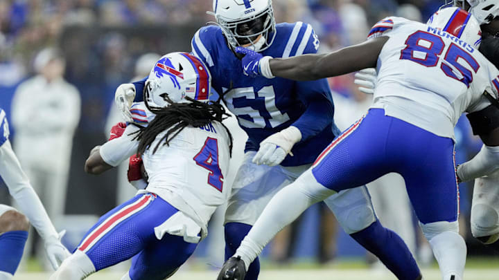 Nov 10, 2024; Indianapolis, Indiana, USA; Buffalo Bills tight end Quintin Morris (85) pulls on the face mask of Indianapolis Colts defensive end Kwity Paye (51) as he moves in to tackle Buffalo Bills running back James Cook (4) on Sunday, Nov. 10, 2024, during a game against the Buffalo Bills at Lucas Oil Stadium in Indianapolis. Mandatory Credit: Grace Hollars-USA TODAY Network via Imagn Images