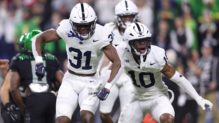 Dec 7, 2024; Indianapolis, IN, USA; Penn State Nittany Lions safety Kolin Dinkins (31) and safety Dejuan Lane (10) react after a play during the first quarter against the Oregon Ducks in the 2024 Big Ten Championship game at Lucas Oil Stadium. Mandatory Credit: Jordan Prather-Imagn Images Dec 7, 2024; Indianapolis, IN, USA; Penn State Nittany Lions safety Kolin Dinkins (31) and safety Dejuan Lane (10) react after a play during the first quarter against the Oregon Ducks in the 2024 Big Ten Championship game at Lucas Oil Stadium. Mandatory Credit: Jordan Prather-Imagn Images