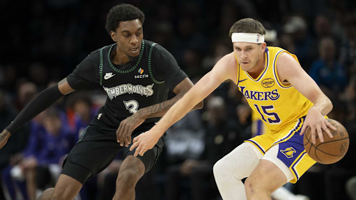 Oct 29, 2025; Minneapolis, Minnesota, USA; Los Angeles Lakers guard Austin Reaves (15) dribbles the ball as Minnesota Timberwolves forward Jaden McDaniels (3) plays defense in the first half at Target Center. Mandatory Credit: Jesse Johnson-Imagn Images Oct 29, 2025; Minneapolis, Minnesota, USA; Los Angeles Lakers guard Austin Reaves (15) dribbles the ball as Minnesota Timberwolves forward Jaden McDaniels (3) plays defense in the first half at Target Center. Mandatory Credit: Jesse Johnson-Imagn Images