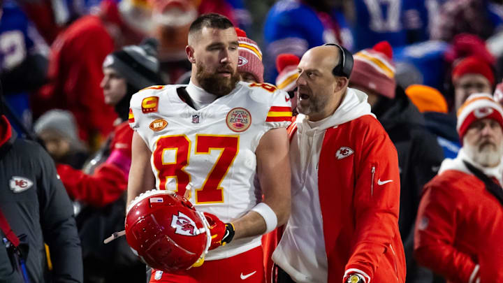 Jan 21, 2024; Orchard Park, New York, USA; Kansas City Chiefs tight end Travis Kelce (87) talks with offensive coordinator Matt Nagy during the first half for the 2024 AFC divisional round game at Highmark Stadium. Mandatory Credit: Mark J. Rebilas-Imagn Images