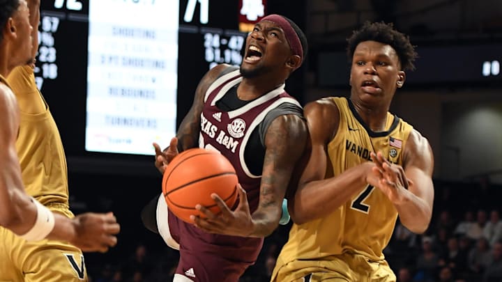 Feb 13, 2024; Nashville, Tennessee, USA; Texas A&M Aggies guard Tyrece Radford (23) attempts a shot against Vanderbilt Commodores forward Ven-Allen Lubin (2) during the second half at Memorial Gymnasium. Mandatory Credit: Christopher Hanewinckel-Imagn Images