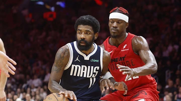 Nov 24, 2024; Miami, Florida, USA; Miami Heat forward Jimmy Butler (22) defends Dallas Mavericks guard Kyrie Irving (11) during overtime at Kaseya Center. Mandatory Credit: Rhona Wise-Imagn Images Nov 24, 2024; Miami, Florida, USA; Miami Heat forward Jimmy Butler (22) defends Dallas Mavericks guard Kyrie Irving (11) during overtime at Kaseya Center. Mandatory Credit: Rhona Wise-Imagn Images