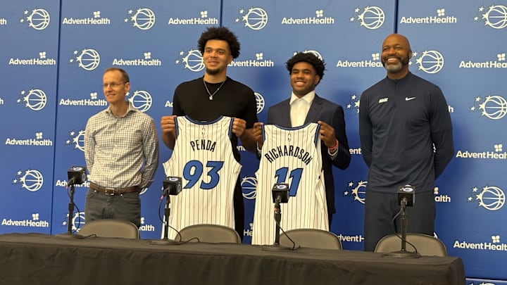 Orlando Magic draft picks Jase Richardson and Noah Penda pose with their jerseys at introductory press conference. 