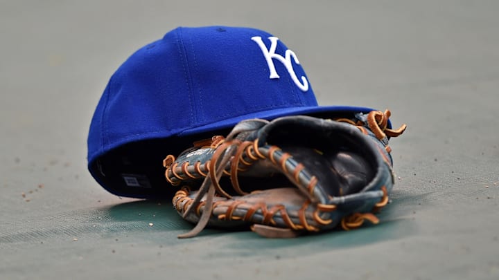 Apr 17, 2015; Kansas City, MO, USA; A general view of the hat and glove of Kansas City Royals first basemen Eric Hosmer the field prior to a game against the Oakland Athletics at Kauffman Stadium. Mandatory Credit: Peter G. Aiken-Imagn Images