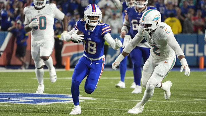 Sep 18, 2025; Orchard Park, New York, USA; Buffalo Bills wide receiver Elijah Moore (18) runs against Miami Dolphins outside linebacker Bradley Chubb (2)