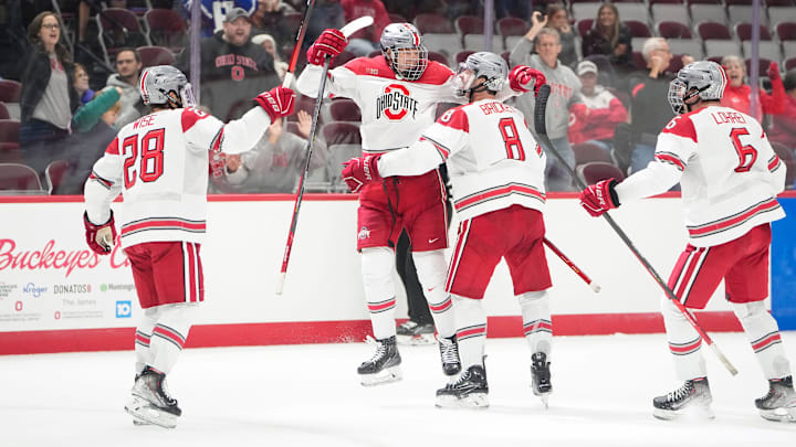 Oct 7, 2022; Columbus, Ohio, USA;  Teammates celebrate a goal by Ohio State Buckeyes forward Stephen Halliday (19) during the NCAA men's hockey game against the Wisconsin Badgers at the Schottenstein Center. Mandatory Credit: Adam Cairns-The Columbus Dispatch

Ncaa Hockey Wisconsin Vs Ohio State