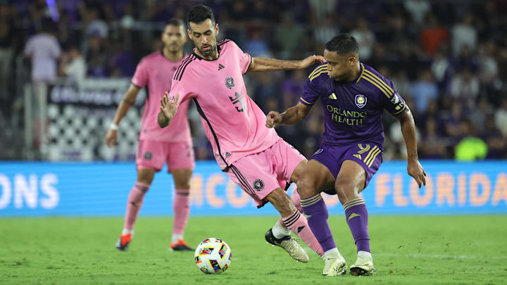May 15, 2024; Orlando, Florida, USA; Inter Miami midfielder Sergio Busquets (5) battles Orlando City forward Luis Muriel (9) in the second half at Inter&Co Stadium. Mandatory Credit: Kim Klement Neitzel-USA TODAY Sports