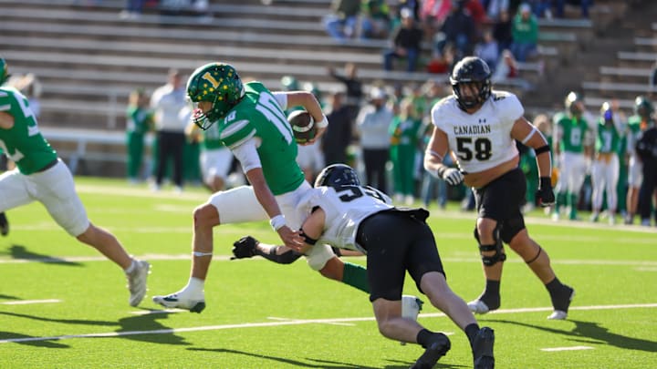 Idalou's Kutter Houchin (10) is tackled by Canadian's Mark Haygood (55) during a Class 3A Division II regional semifinal game Friday, Nov. 29, 2024 at Happy State Bank in Canyon, Texas.