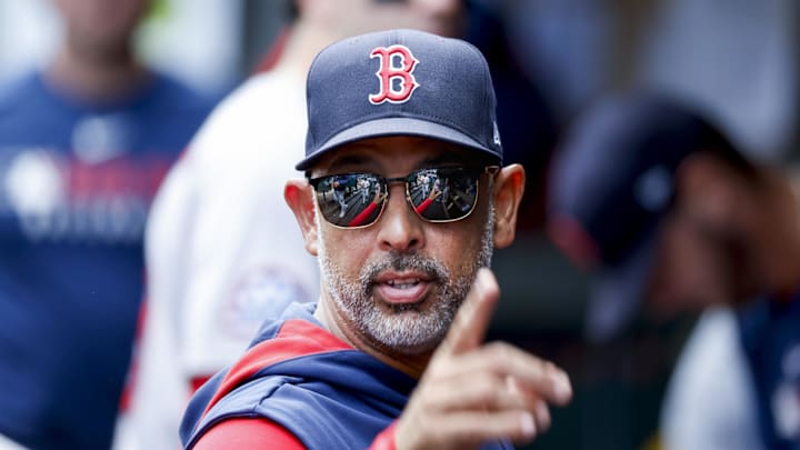Seattle, Washington, USA; Boston Red Sox manager Alex Cora (13) stands in the dugout following the inning against the Seattle Mariners at T-Mobile Park.