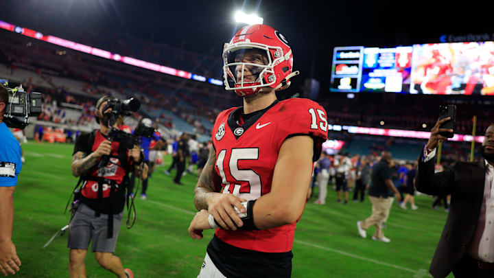 Georgia Bulldogs quarterback Carson Beck walks off the field after the game against Florida.
