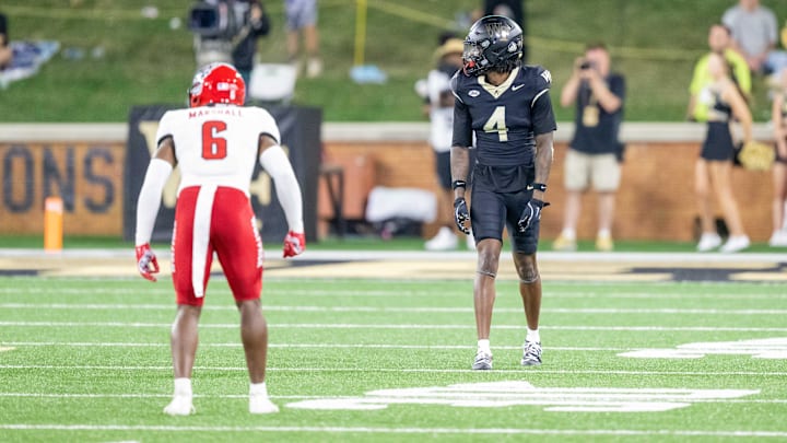 Sep 11, 2025; Winston-Salem, North Carolina, USA;  Wake Forest Demon Deacons wide receiver Sterling Berkhalter (4) lines up in the first half against North Carolina State Wolfpack cornerback Devon Marshall (6) at Allegacy Federal Credit Union Stadium. Mandatory Credit: Luke Jamroz-Imagn Images