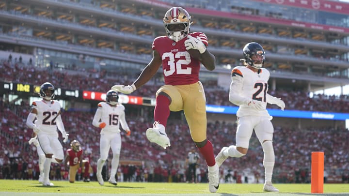 August 9, 2025; Santa Clara, California, USA; San Francisco 49ers running back Patrick Taylor Jr. (32) scores a touchdown against Denver Broncos cornerback Riley Moss (21) during the first quarter at Levi's Stadium. Mandatory Credit: Kyle Terada-Imagn Images