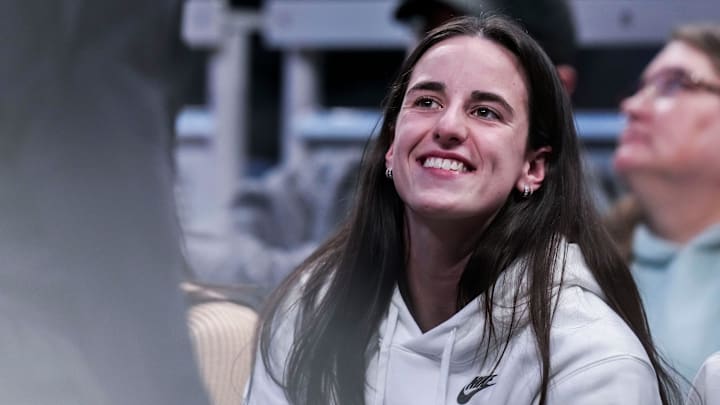 Indiana Fever guard Caitlin Clark (22) smiles Thursday, March 6, 2025, in a round two game at the 2025 TIAA Big Ten Women's Basketball Tournament between the Iowa Hawkeyes and the Michigan State Spartans at Gainbridge Fieldhouse in Indianapolis.