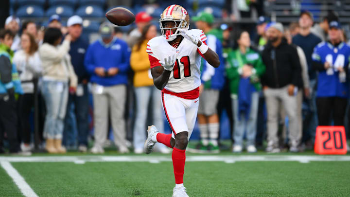 Oct 10, 2024; Seattle, Washington, USA; San Francisco 49ers wide receiver Brandon Aiyuk (11) catches the ball during warmups before the game against the Seattle Seahawks at Lumen Field. Mandatory Credit: Steven Bisig-Imagn Images