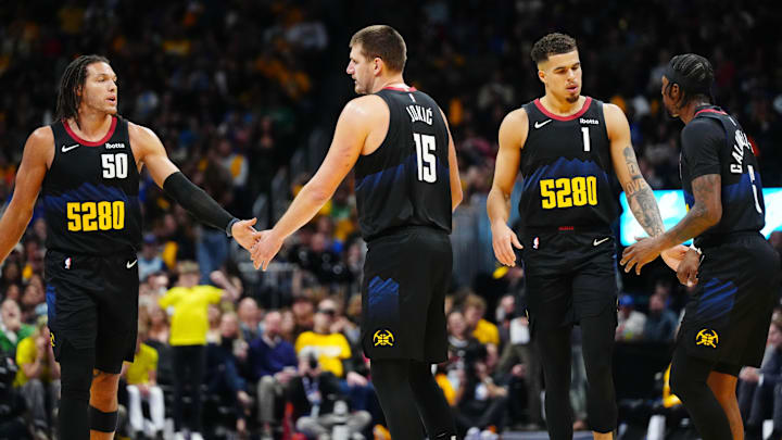 Nov 3, 2023; Denver, Colorado, USA; Denver Nuggets forward Aaron Gordon (50), center Nikola Jokic (15), forward Michael Porter Jr. (1) and guard Kentavious Caldwell-Pope (5) celebrate a score in the second half against the Dallas Mavericks at Ball Arena. Mandatory Credit: Ron Chenoy-Imagn Images