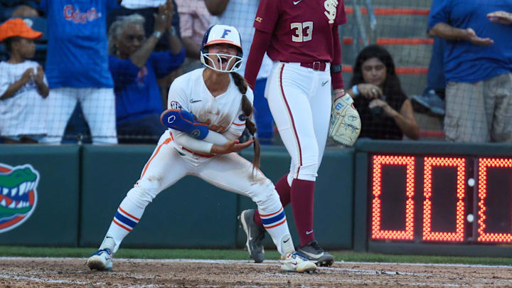 Florida infielder Gabi Comia (10) celebrates stealing home during a NCAA softball game at Katie Seashole Pressly Stadium in Gainesville, FL on Tuesday, April 28, 2026. [Alan Youngblood/Gainesville Sun]