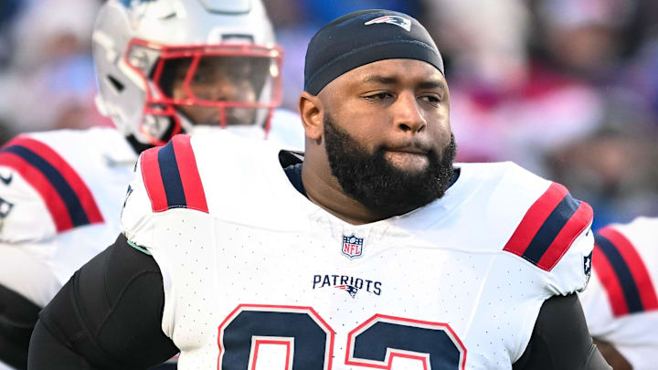 Dec 22, 2024; Orchard Park, New York, USA; New England Patriots defensive tackle Davon Godchaux (92) enters the field before a game against the Buffalo Bills at Highmark Stadium. Mandatory Credit: Mark Konezny-Imagn Images