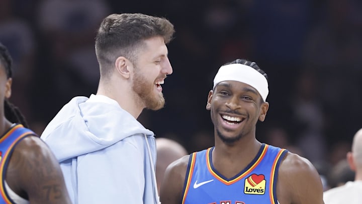 Nov 13, 2024; Oklahoma City, Oklahoma, USA; Oklahoma City Thunder center Isaiah Hartenstein (55) and guard Shai Gilgeous-Alexander (2) before the start of a game against the New Orleans Pelicans at Paycom Center. Mandatory Credit: Alonzo Adams-Imagn Images Nov 13, 2024; Oklahoma City, Oklahoma, USA; Oklahoma City Thunder center Isaiah Hartenstein (55) and guard Shai Gilgeous-Alexander (2) before the start of a game against the New Orleans Pelicans at Paycom Center. Mandatory Credit: Alonzo Adams-Imagn Images