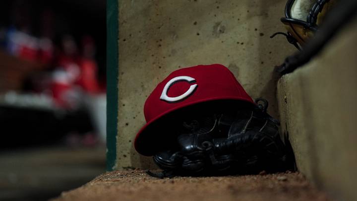 Jun 24, 2026; Cincinnati, Ohio, USA; A Reds on field hat is seen on the dugout steps during the game between the Milwaukee Brewers and the Cincinnati Reds in the eighth inning at Great American Ball Park. Mandatory Credit: Aaron Doster-Imagn Images Jun 24, 2026; Cincinnati, Ohio, USA; A Reds on field hat is seen on the dugout steps during the game between the Milwaukee Brewers and the Cincinnati Reds in the eighth inning at Great American Ball Park. Mandatory Credit: Aaron Doster-Imagn Images