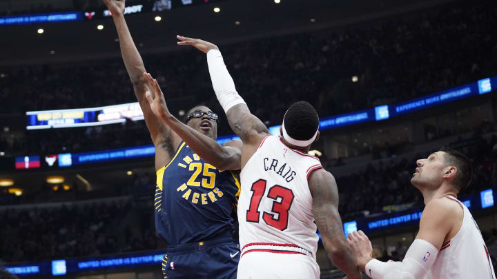 Mar 27, 2024; Chicago, Illinois, USA; Indiana Pacers forward Jalen Smith (25) shoots over Chicago Bulls forward Torrey Craig (13) during the first quarter at United Center. Mandatory Credit: David Banks-USA TODAY Sports Mar 27, 2024; Chicago, Illinois, USA; Indiana Pacers forward Jalen Smith (25) shoots over Chicago Bulls forward Torrey Craig (13) during the first quarter at United Center. Mandatory Credit: David Banks-USA TODAY Sports