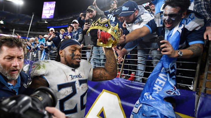 Tennessee Titans fan Mohammed Khan gives running back Derrick Henry (22) a crown after a game. 