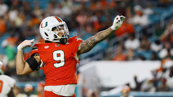 Sep 7, 2024; Miami Gardens, Florida, USA; Miami Hurricanes defensive lineman Tyler Baron (9) celebrates after sacking Florida A&M Rattlers quarterback Daniel Richardson (not pictured) during the third quarter at Hard Rock Stadium. Mandatory Credit: Sam Navarro-Imagn Images