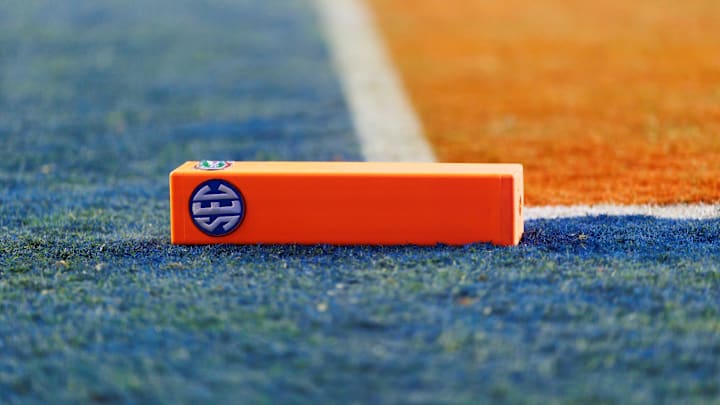 A pylon lays sideways on the ground featuring a SEC logo A pylon lays sideways on the ground featuring a SEC logo