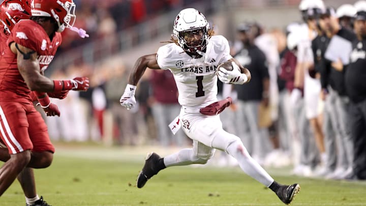 Oct 18, 2025; Fayetteville, Arkansas, USA; Texas A&M Aggies wide receiver Izaiah Williams (1) runs after a catch during the fourth quarter against the Arkansas Razorbacks at Donald W. Reynolds Razorback Stadium. Mandatory Credit: Nelson Chenault-Imagn Images