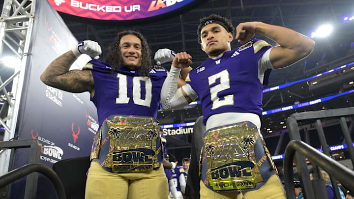 Dec 13, 2025; Inglewood, CA, USA;  Washington Huskies linebacker Xe'Ree Alexander (10) and quarterback Demond Williams Jr. (2) celebrate after being named offensive and defensive players of the game as they defeating the Boise State Broncos in the LA Bowl at SoFi Stadium. Mandatory Credit: Jayne Kamin-Oncea-Imagn Images