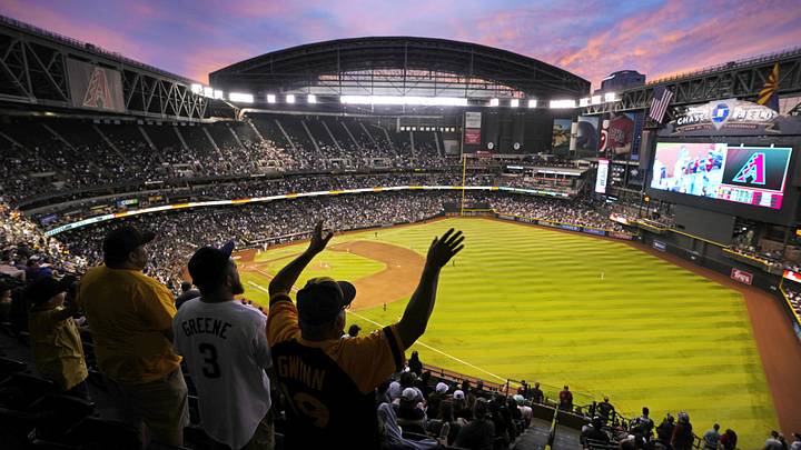 Padres fans watch the sun set in the seventh inning during a game against the Diamondbacks at Chase Field in Phoenix on April 22, 2023.