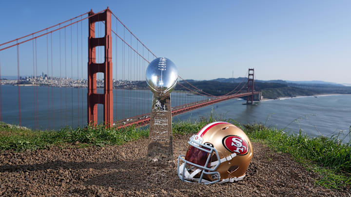 Jan 29, 2026; San Francisco, California, USA; A San Francisco 49ers helmet with a Vince Lombardi Super Bowl trophy at the Golden Gate bridge. Mandatory Credit: Kirby Lee-Imagn Images