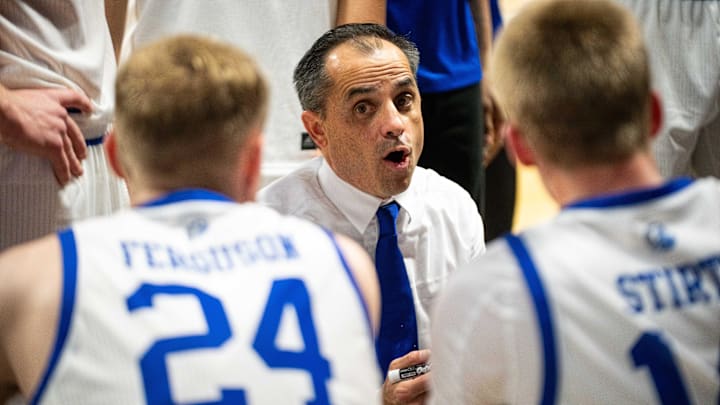 Drake head coach Ben McCollum talks with his team during a second half timeout on Monday, Nov. 4, 2024, at the Knapp Center.