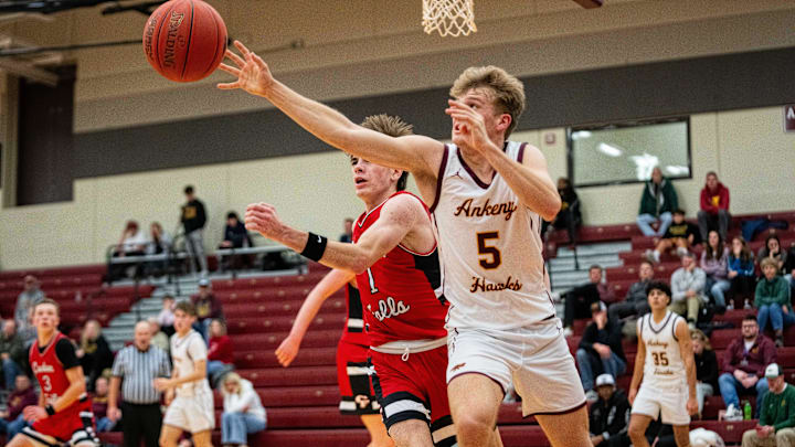 Ankeny's Luke Anderson (5) reaches for the ball to keep possession on Thursday, Dec. 19, 2024, at Ankeny High School.