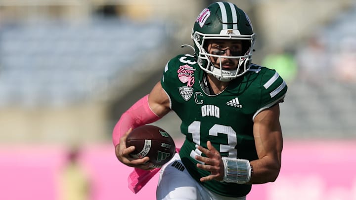 Dec 20, 2024; Orlando, FL, USA; Ohio Bobcats quarterback Parker Navarro (13) runs with the ball against the Jacksonville State Gamecocks in the second quarter at Camping World Stadium. Mandatory Credit: Nathan Ray Seebeck-Imagn Images