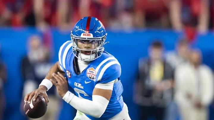 Jan 8, 2026; Glendale, AZ, USA; Mississippi Rebels quarterback Trinidad Chambliss (6) against the Miami Hurricanes during the 2026 Fiesta Bowl and semifinal game of the College Football Playoff at State Farm Stadium. Mandatory Credit: Mark J. Rebilas-Imagn Images Jan 8, 2026; Glendale, AZ, USA; Mississippi Rebels quarterback Trinidad Chambliss (6) against the Miami Hurricanes during the 2026 Fiesta Bowl and semifinal game of the College Football Playoff at State Farm Stadium. Mandatory Credit: Mark J. Rebilas-Imagn Images