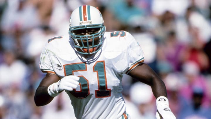Miami Dolphins linebacker Bryan Cox in action against the New England Patriots at Foxboro Stadium in 1995.