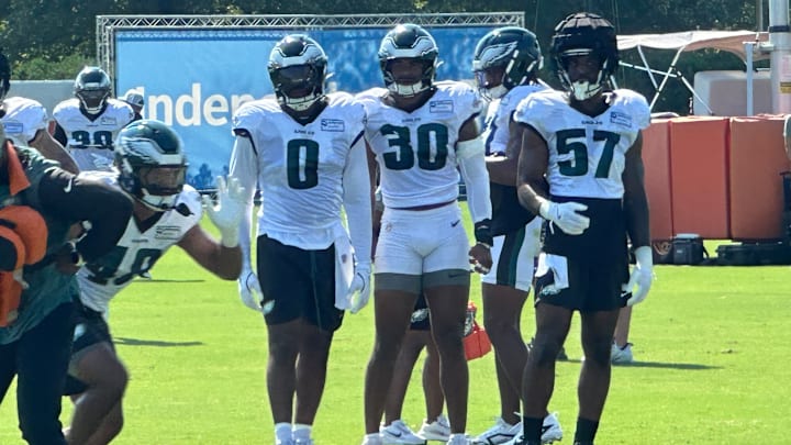 Eagles' defenders Josh Uche (0), Jihaad Campbell (30), and Dallas Gant (57) at practice on July 28, 2025