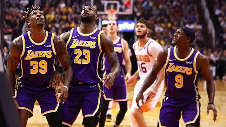 Nov 12, 2019; Phoenix, AZ, USA; Los Angeles Lakers center Dwight Howard (39), forward LeBron James (23) and guard Rajon Rondo (9) look for a rebound against the Phoenix Suns at Talking Stick Resort Arena. Mandatory Credit: Mark J. Rebilas-Imagn Images Nov 12, 2019; Phoenix, AZ, USA; Los Angeles Lakers center Dwight Howard (39), forward LeBron James (23) and guard Rajon Rondo (9) look for a rebound against the Phoenix Suns at Talking Stick Resort Arena. Mandatory Credit: Mark J. Rebilas-Imagn Images
