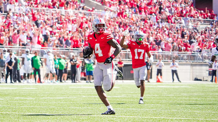 Sep 21, 2024; Columbus, Ohio, USA; Ohio State Buckeyes wide receiver Jeremiah Smith (4) runs the ball in for a touchdown against the Marshall Thundering Herd in the second half at Ohio Stadium on Saturday.