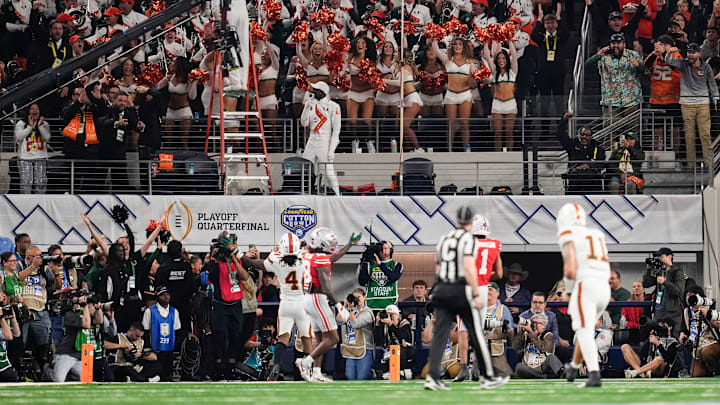 Miami Hurricanes running back Mark Fletcher Jr. (4) scores a touchdown during the Cotton Bowl at AT&T Stadium in Arlington, Texas for the College Football Playoff quarterfinal game against the Ohio State Buckeyes on Dec. 31, 2025.