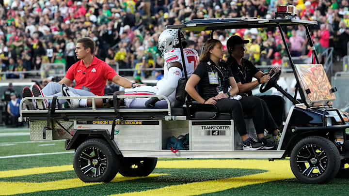 Ohio State tackle Josh Simmons had his 2024 season end with a ride off the field on a cart after a torn patellar tendon.