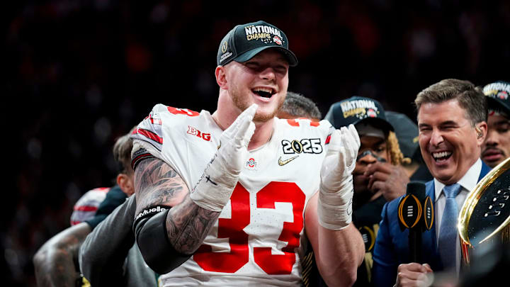 Ohio State Buckeyes defensive end Jack Sawyer (33) celebrates after defeating Notre Dame Fighting Irish in the College Football Playoff championship game at Mercedes-Benz Stadium in Atlanta on Jan. 21, 2025. Ohio State Buckeyes defensive end Jack Sawyer (33) celebrates after defeating Notre Dame Fighting Irish in the College Football Playoff championship game at Mercedes-Benz Stadium in Atlanta on Jan. 21, 2025.