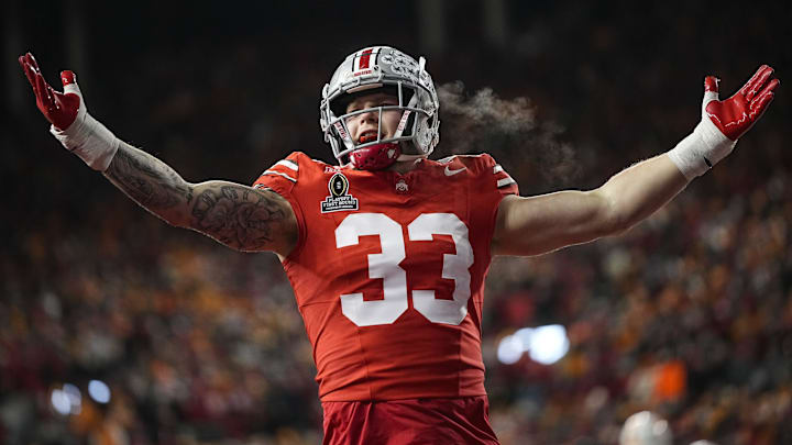 Ohio State Buckeyes defensive end Jack Sawyer (33) celebrates a sack of Tennessee Volunteers quarterback Nico Iamaleava (8) during the first half of the College Football Playoff first round game at Ohio Stadium in Columbus on Dec. 21, 2024.