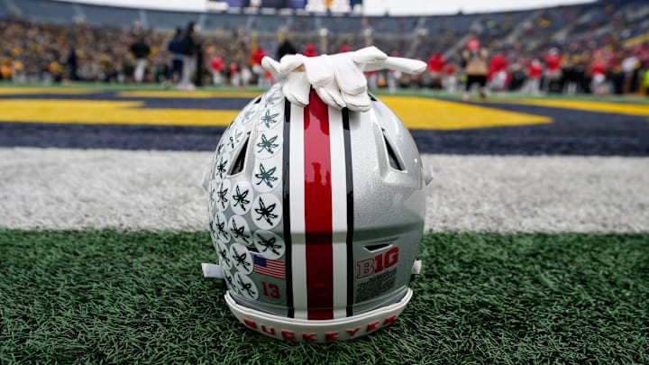 An Ohio State Buckeyes helmet sits behind the endzone as the team warms up for its game against the Michigan Wolverines during the NCAA football game at Michigan Stadium in Ann Arbor, Mich. on Nov. 29, 2025. Ohio State won 27-9.