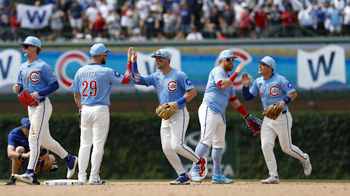 Jul 4, 2025; Chicago, Illinois, USA; Chicago Cubs players celebrate team's win against the St. Louis Cardinals at Wrigley Field. Jul 4, 2025; Chicago, Illinois, USA; Chicago Cubs players celebrate team's win against the St. Louis Cardinals at Wrigley Field.